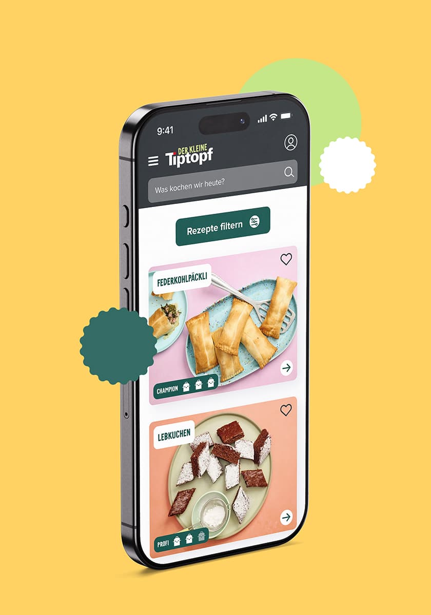 iPhone mit Website-Screen von Rezepte-Grid auf gelbem Hintergrund